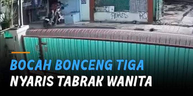 VIDEO: Bocah Bonceng Tiga Nyaris Tabrak Wanita yang Sedang Duduk