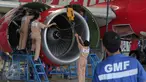 Teknisi tengah melakukan perbaikan pesawat di Hanggar 4 GMF, Tangerang, Jumat (6/11/2015). Untuk mendukung operasional hanggar tersebut dibutuhkan setidaknya ratusan teknisi hingga akhir tahun.(Liputan6.com/Angga Yuniar)