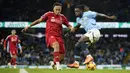 <p>Pemain Manchester City, Jeremy Doku (kanan) berebut bola dengan pemain Nottingham Forest, Eric da Silva Moreira pada laga lanjutan Liga Inggris 2024/2025 di Etihad Stadium, Manchester, Inggris, Kamis (05/12/2024). (AP Photo/Martin Rickett)</p>