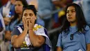 Kesedihan Suporter Uruguay saat timnya kalah dari Venezuela pada babak penyisihan grup Copa America Centenario 2016 di Stadion Lincoln Financial Field, Philadelphia, AS, (10/6/2016). (AFP/Don Emmert)