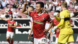 Jeong Woo-yeong. Gelandang berusia 22 tahun ini kini memasuki musim keduanya di SC Freiburg di Liga Jerman sejak dipulangkan dari masa peminjaman di Tim Akademi Bayern Munchen pada awal 2020/2021. Musim ini ia telah tampil dalam 13 laga di semua ajang dengan mencetak 3 gol. (AFP/Thomas Kienzle)
