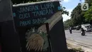 Mural berisi pesan pencegahan penularan virus COVID-19 di Jalan Raya Jakarta Bogor, Depok, Selasa (7/4/2020). Sejumlah pesan disampaikan dengan beragam cara untuk mengingatkan masyarakat agar ikut serta dalam upaya memutus mata rantai penyebaran COVID-19. (Liputan6.com/Helmi Fithriansyah)