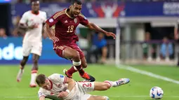 Les Rouges berhasil mengandaskan perlawanan Venezuela lewat babak adu penalti. (CHARLY TRIBALLEAU/AFP)