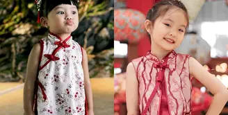 Mirabelle, anak dari Angel Cherry Belle tampil mengenakan cheongsam model sleeveless warna pink-merah. [@mirabelle_tiffany]