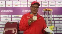 Pecatur putra Indonesia, Maksum Firdaus, berhasil meraih dua medali perak di Asian Para Games 2018. (Bola.com/Benediktus Gerando Pradigdo)