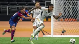 Barcelona meraih kemenangan dengan skor yang meyakinkan yakni 3-0 atas rival klasiknya tersebut. (AP Photo/Jeffrey McWhorter)