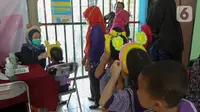 Kegiatan imunisasi ini diikuti oleh 100 peserta dari murid Pendidikan Anak Usia Dini (PAUD) di sekitar Kecamatan Gambir. (Liputan6.com/Herman Zakharia)