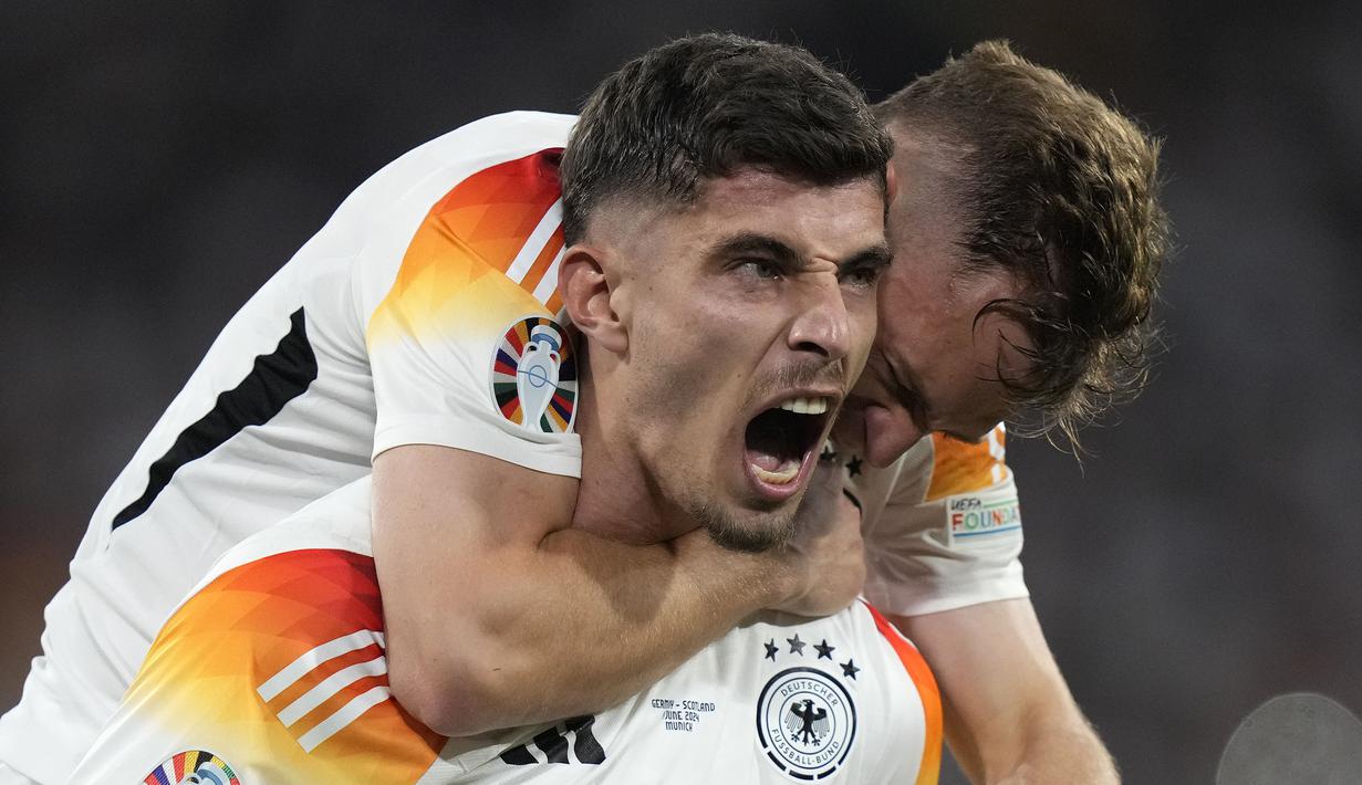 Pemain Jerman, Kai Havertz melakukan selebrasi setelah mencetak gol ketiga timnya ke gawang Skotlandia pada laga pembuka Grup A Euro 2024 di Allianz Arena, Munchen, Jerman, Sabtu (15/06/2024) WIB. (AP Photo/Matthias Schrader)