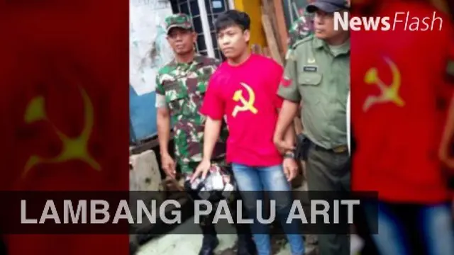 Aparat Koramil Ciputat menangkap Susanto lantaran menggunakan kaus bergambar palu arit, di Jalan Aria Putra, Kecamatan Ciputat, Tangsel.