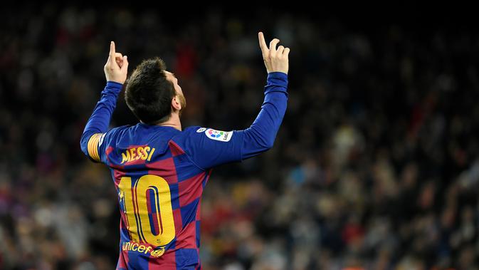 Striker Barcelona, Lionel Messi, merayakan gol ke gawang Granada (LLUIS GENE / AFP)