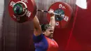 Lifter Indonesia, Nurul Akmal melakukan angkatan di kelas 75+ kilogram putri angkat besi Asian Games 2018 di JI Expo,Kemayoran, Jakarta, Senin (27/8). Nurul Akmal gagal meraih medali dengan total seberat 253 kilogram. (Lipujtan6.com/Helmi Fithriansyah)