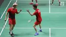 Ganda putra Indonesia, Kevin Sanjaya S/Marcus F Gideon bersorak saat melawan Fajar Alfian/M Rian Ardianto di Final Bulutangkis Asian Games 2018 di Istora GBK, Jakarta, Selasa (28/8). Kevin/Marcus unggul. (Liputan6.com/Helmi Fithriansyah)