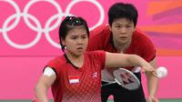 Pertama kali tampil di Olimpiade adalah saat Olimpiade London 2012, Inggris. Greysia Polii saat itu berpasangan dengan Meiliana Jauhari yang mulai dipasangkan sejak Januari 2010. (Foto: AFP/Adek Berry)