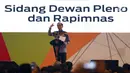 Presiden Joko Widodo atau Jokowi berbicara dalam Sidang Dewan Pleno II dan Rapimnas HIPMI di Tangerang, Rabu (7/3). Rapimnas mengusung tema 'Redistribusi Ekonomi dan Peran Pengusaha Muda dalam Memperkokoh Daya Saing Bangsa'. (Liputan6.com/Angga Yuniar)