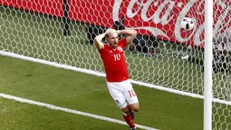 Pemain Wales, Aaron Ramsey adalah salah satu punggawa Arsenal yang bersinar bersama negaranya selama hingga babak perempat final Pala Eropa 2016 di Prancis, (25/6/2016) (REUTERS/Christian Hartmann)