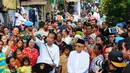 Pasangan Capres Cawapres Joko Widodo (Jokowi)-Ma'ruf Amin menyampaikan pidato kemenangannya di Kampung Deret, Tanah Tinggi, Jakarta, Selasa (21/5/2019). Pidato tersebut menanggapi keputusan KPU yang menetapkan pasangan Jokowi-Ma'ruf Amin sebagai pemenang Pilpres 2019. (Liputan6.com/Angga Yuniar)