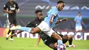 Pemain Manchester City, Raheem Sterling, melepaskan tendangan ke gawang Lyon pada perempat final Liga Champions di Stadion Jose Alvalade, Sabtu (15/8/2020). Lyon menang 3-1 atas Manchester City. (Franck Fife/Pool/via AP)