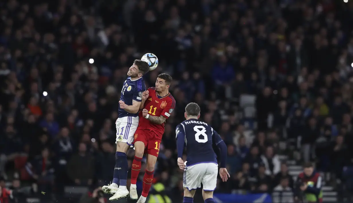 <p>Kemenangan ini menempatkan Skotlandia di puncak klasemen dengan enam poin. Spanyol di urutan kedua dengan tiga angka. (AP Photo/Scott Heppell)</p>
