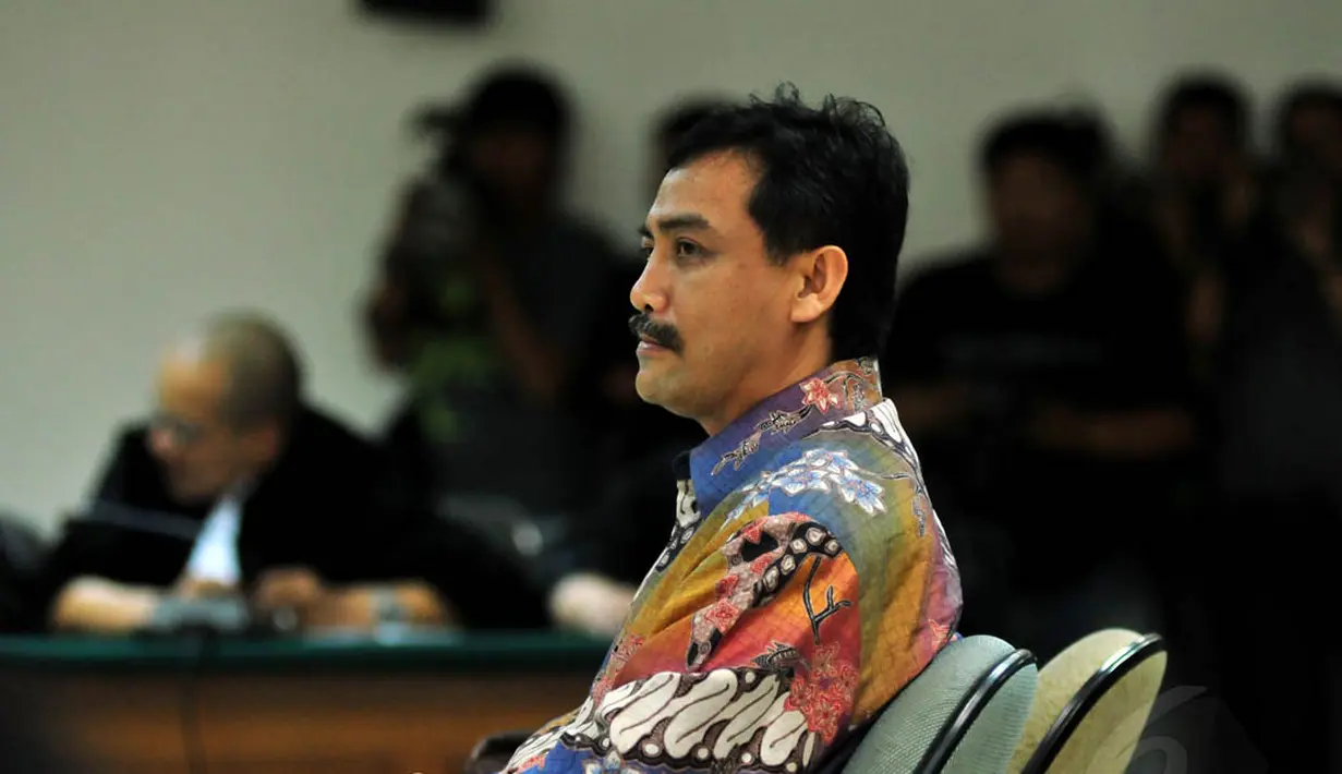 Andi Mallarangeng saat mendengarkan putusan dari majles hakim di Pengadilan Tipikor, Jakarta, Jumat (18/7/14) (Liputan6.com/Johan Tallo)