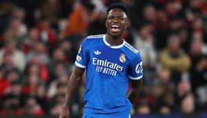 Pemain Real Madrid, Vinicius Junior, bereaksi dalam laga fase awal Liga Champions antara SL Benfica melawan Real Madrid, Rabu (18/2/2026). (AP Photo/Pedro Rocha)