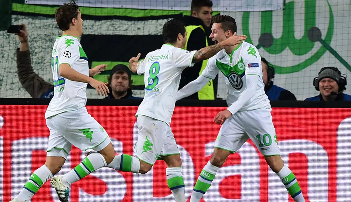 Juara grup B, Wolfsburg. Klub asal Jerman ini memberikan kejutan lolos usai menaklukan Manchester United. (AFP/John Macdougall)