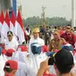 Jokowi di Gerbang Tol Limapuluh, Batu Bara, Sumut, Rabu (7/2/2024) (Reza Efendi/Liputan6.com)