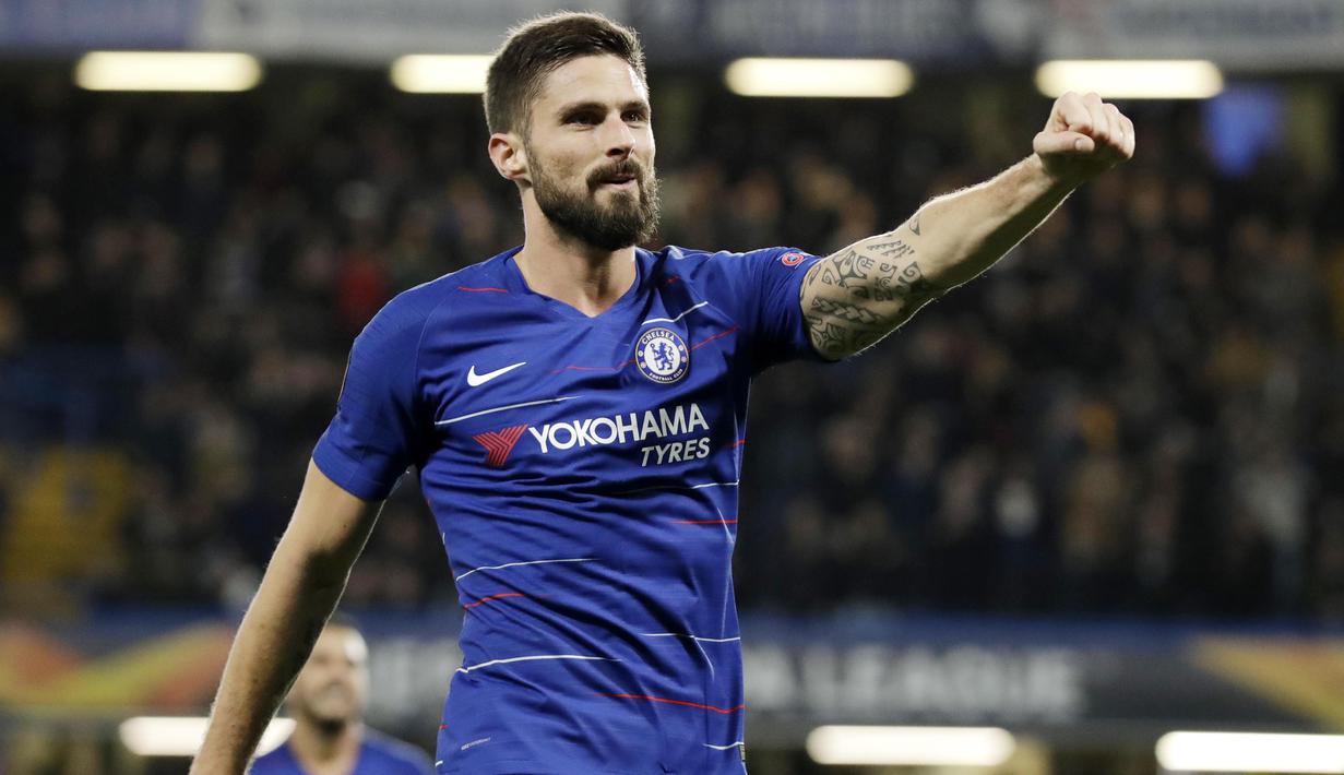 Striker Chelsea, Oliver Giroud, melakukan selebrasi usai membobol gawang PAOK Thessaloniki pada laga Liga Europa di Stadion Stamford Bridge, Kamis (29/11). Chelsea menang 4-0 atas PAOK Thessaloniki. (AP/Matt Dunham)