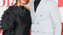 Pasangan penyanyi, Liam Payne dan Cheryl Cole menghadiri karpet merah BRIT Awards 2018 di London, Rabu (21/2). Sempat dikabarkan putus, Liam Payne dan Cheryl membuktikan hubungan mereka baik-baik saja dengan hadir bersama. (Vianney Le Caer/Invision/AP)