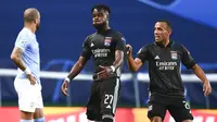 Pemain Lyon, Maxwel Cornet, melakukan selebrasi usai mencetak gol ke gawang Manchester City di perempat final Liga Champions di Stadion Jose Alvalade, Sabtu (15/8/2020). Lyon menang 3-1 atas Manchester City. (Franck Fife/Pool/via AP)