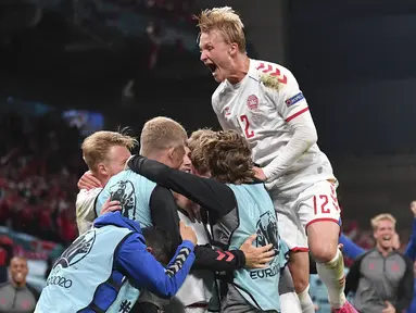 Denmark sukses berpesta gol di gawang Rusia usai kalahkan mereka dengan skor 4-1 pada pertandingan Grup B Euro 2020 yang berlangsung di Stadion Parken, Kopenhagen Denmark. (Foto: AP/Pool/Stuart Franklin)