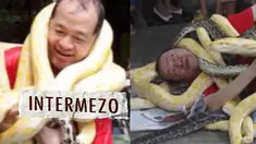 Seorang pria mengabadikan kedekatannya dengan beberapa ular dalam rangka memeriahkan tahun baru Cina 2013 yang disebut tahun ular di kebun binatang di Malabon, Manila.