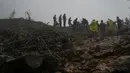 Rekor hujan monsun menewaskan lebih dari 100 orang di India utara selama dua minggu terakhir, kata para pejabat, karena hujan deras menyebabkan jalan-jalan runtuh dan rumah-rumah runtuh. (AP Photo/Rafiq Maqbool)