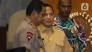 Menteri Dalam Negeri Tito Karnavian sebelum mengikuti rapat gabungan lintas kementerian dan lembaga di kompleks Parlemen, Senayan, Jakarta, Rabu (4/2/2020). Rapat membahas persiapan pelaksanaan Pekan Olahraga Nasional (PON) XX tahun 2020 di Papua. (Liputan6.com/Johan Tallo)