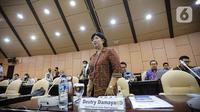 Deputi Gubernur Senior Bank Indonesia (BI) Destry Damayanti usai mengikuti rapat kerja dengan DPD RI di Kompleks Parlemen, Senayan, Jakarta, Rabu (14/6/2023). (Liputan6.com/Faizal Fanani)