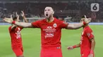 Pemain Persija Masko Simic melakukan selebrasi usai mencetak gol ke gawang Geylang International FC pada pertandingan persahabatan di SUGBK, Jakarta, Minggu (23/2/2020). Persija membungkam Geylang 3-1. (Liputan6.com/Angga Yuniar)