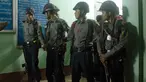Petugas kepolisian melakukan penjagaan di kamar mayat rumah sakit di pinggiran kota Yangon, Myanmar, Minggu (29/1). Seorang pengacara Muslim terkemuka dan anggota dari partai yang berkuasa di Myanmar, Ko Ni, ditembak mati. (AP Photo/Thein Zaw)