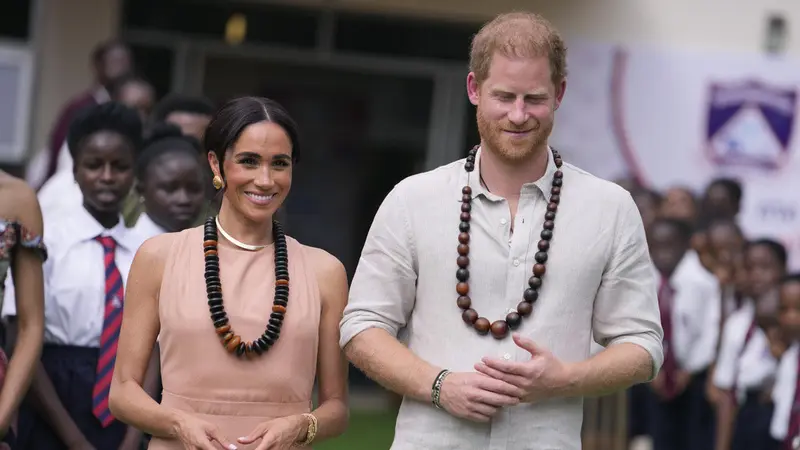 Meghan Markle dan Pangeran Harry. (AP Photo/Sunday Alamba)