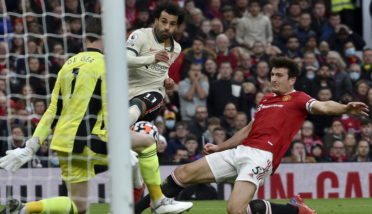 Harry Maguire. Mendapatkan poin 3. Kapten tim Manchester United ini menjadi pemain belakang terburuk dalam menghadapi gelombang serangan para pemain Liverpool. Amat pantas jika ia sebagai tertuduh atas lahirnya kelima gol Liverpool. (AP/Rui Vieira)