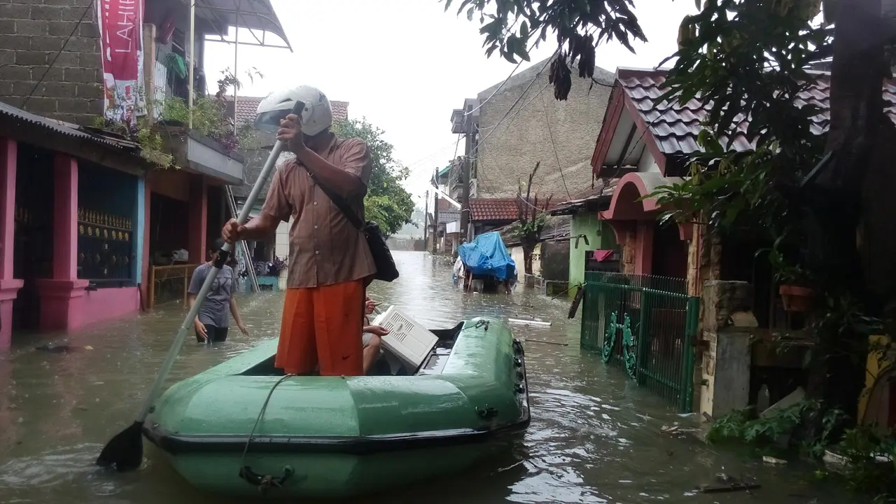 Banjir di perumahan Tangerang. (Liputan6.com/Naomi Trisna)