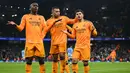 Pemain Real Madrid Vinicius Junior, Brahim Diaz dan Kylian Mbappe (kiri ke kanan) saat merayakan kemenangan pada leg pertama play-off fase gugur Liga Champions 2024/2025 melawan Manchester City di Stadion Etihad, Manchester, Inggris, pada 11 Februari 2025 waktu setempat atau Rabu 12 Februari 2025 dininhari WIB. (Oli SCARFF/AFP)