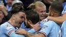 Para pemain Manchester City merayakan gol yang dicetak oleh Bernardo Silva ke gawang Real Madrid pada laga semifinal leg kedua di Stadion Etihad, Kamis (18/5/2023). Man City menang dengan skor 4-0. (Nick Potts/PA via AP)