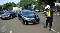 Jakarta, yang dikenal dengan kemacetan lalu lintasnya, kembali menerapkan kebijakan ganjil genap pada hari ini, Selasa (26/11/2024). (Liputan6.com/Gempur M Surya)
