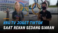 Dibantu kru lain yang merekam, ia berjoget dan jalan mundur di depan lambang cincin olimpiade.