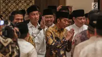 Presiden Joko Widodo (Jokowi) tiba untuk menghadiri acara Buka Puasa Bersama Partai Golkar, di Jakarta, Minggu (19/5/2019). Kegiatan tersebut mengangkat tema Menjemput Kemenangan Ramadan. (Liputan6.com/Faizal Fanani)