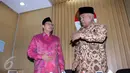 Menag Lukman Hakim Saifuddin (kiri) bersama Plt. Ketua KPK Taufiequrachman Ruki (kanan) usai memaparkan mekanisme penerapan pelaksanaan PP Nomor 48 Tahun 2014 di Gedung KPK, Jakarta, Kamis (25/6/15). (Liputan6.com/Helmi Afandi)