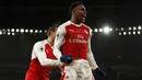 Penyerang Arsenal, Alex Iwobi, merayakan gol yang dicetaknya ke gawang Crystal Palace. The Gunners berhasil memperbesar keunggulan dan memastikan kemenangan menjadi 2-0 pada menit ke-56 melalui gol dari Iwobi. (Reuters/John Sibley)