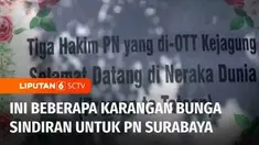 Pascapenangkapan tiga hakim karena diduga menerima suap di balik vonis bebas Gregorius Ronald Tannur, Kantor Pengadilan Negeri Surabaya dihiasi karangan bunga berisi sindiran dan pesan moral. Karangan bunga inipun menjadi tontonan warga.