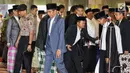 Presiden Joko Widodo atau Jokowi tiba untuk melaksanakan salat Id di Masjid Istiqlal, Jakarta, Rabu (5/6/2019). Jokowi hadir sekitar pukul 06.40 WIB ditemani Ibu Negara Iriana dan putranya, Kaesang Pangarep. (Liputan6.com/JohanTallo)