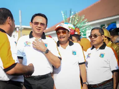 Gubernur DKI, Basuki Tjahaja Purnama dan Wagub Djarot Saiful Hidayat saat menghadiri pembukaan perayaan HUT Jakarta yang ke-488, di Taman Fatahillah, Jakarta, Minggu (31/5/2015). (Liputan6.com/Faizal Fanani)