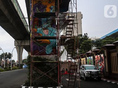 Mural terlihat di kawasan Lapangan Bhayangkara, Mabes Polri, Jakarta, selasa (2/11/2021). Selama ini seni mural kurang mendapatkan tempat di fasilitas-fasilitas umum dan Pembuatan Mural ini bagian dalam rangka Bhayangkara Mural Festival 2021. (Liputan6.com/Johan Tallo)